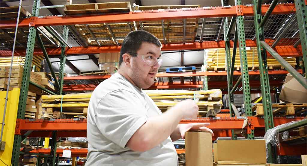 Easterseals RISE Isaiah packaging a product