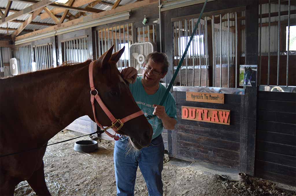 Easterseals RISE Norman enjoying grooming